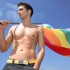 Young-man-with-Gay-Pride-flag-via-Shutterstock