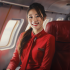 livevol_Chinese_flight_attendant_smiling_in_the_cabin_about_170_3487367d-d068-48d6-bcf6-c39c523eabe3